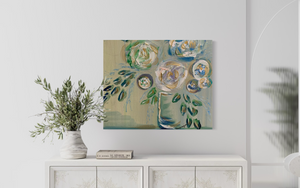 Abstract painting on a wall above a white console table with decorative items.

