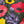 Framed painting of colorful flowers on a wall