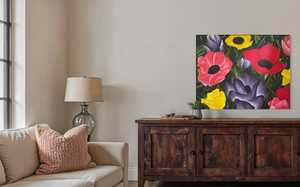 Floral painting on a wall above a wooden cabinet in a living room.