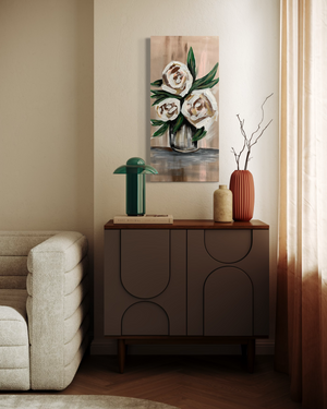Modern living room with a sideboard, decorative vases, and a floral painting.